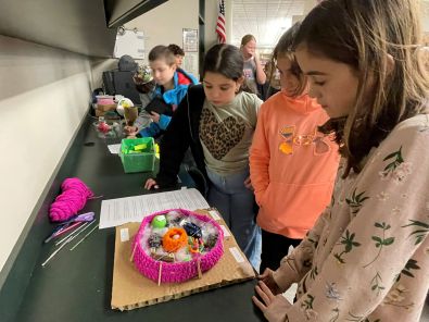 sarah examines project- smaller.jpg