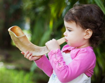 kid blowing shofar.png